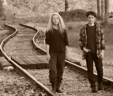 photo of Elaine and Eileen walking on the train tracks